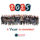 2025 is shown in red and navy blocks for each digit, the digit is white. A Photo of the Quinns team (on white backgroun) "A Year to remember!" under the image. Quinns logo in red and navy. Solid white background